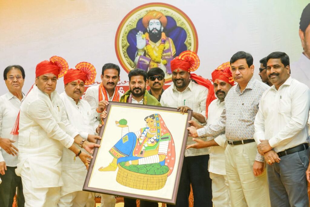 CM RECEIVINNG A TRIBAL PICTRURE FROM TRIBALS
