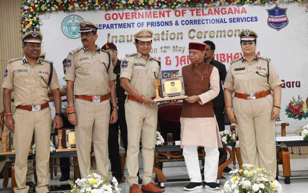 GOVERNOR PRESENTING MOMONTOES TO THE JAIL DEPARTMENT OFFICIALS